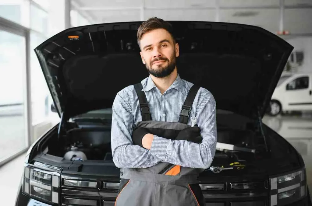 How Much is a Car Service – professional mechanic performing a full car service and vehicle maintenance inspection in a garage